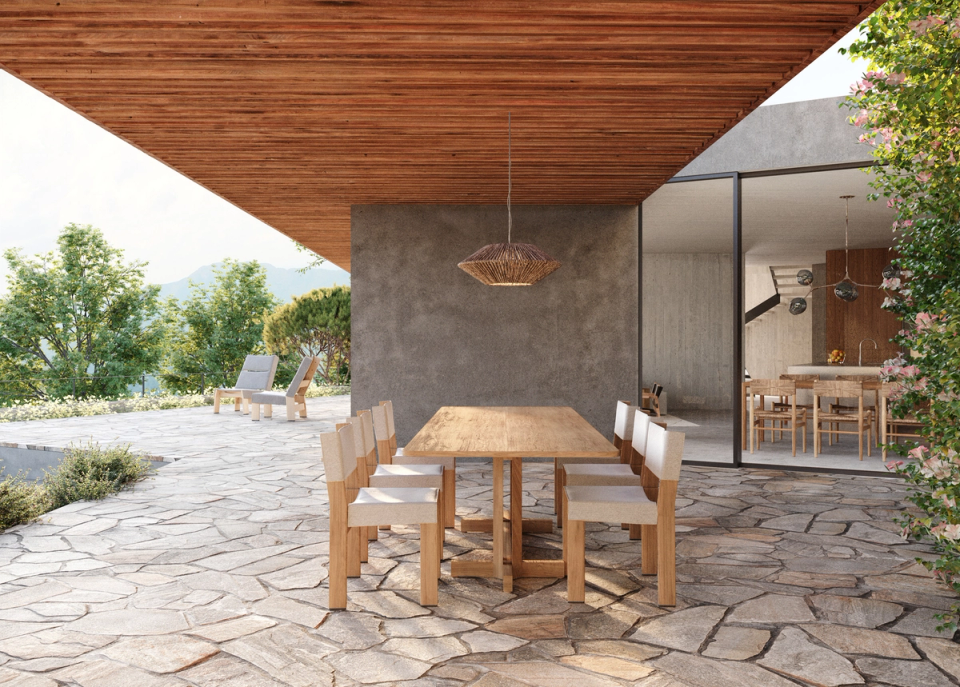 Outdoor spaces of the detached house designed to experience the Mediterranean landscape with comfort and naturalness. The combination of stone, wood, and large openings creates warm and contemporary architecture, where covered terraces and a fluid connection with the interior enhance outdoor living