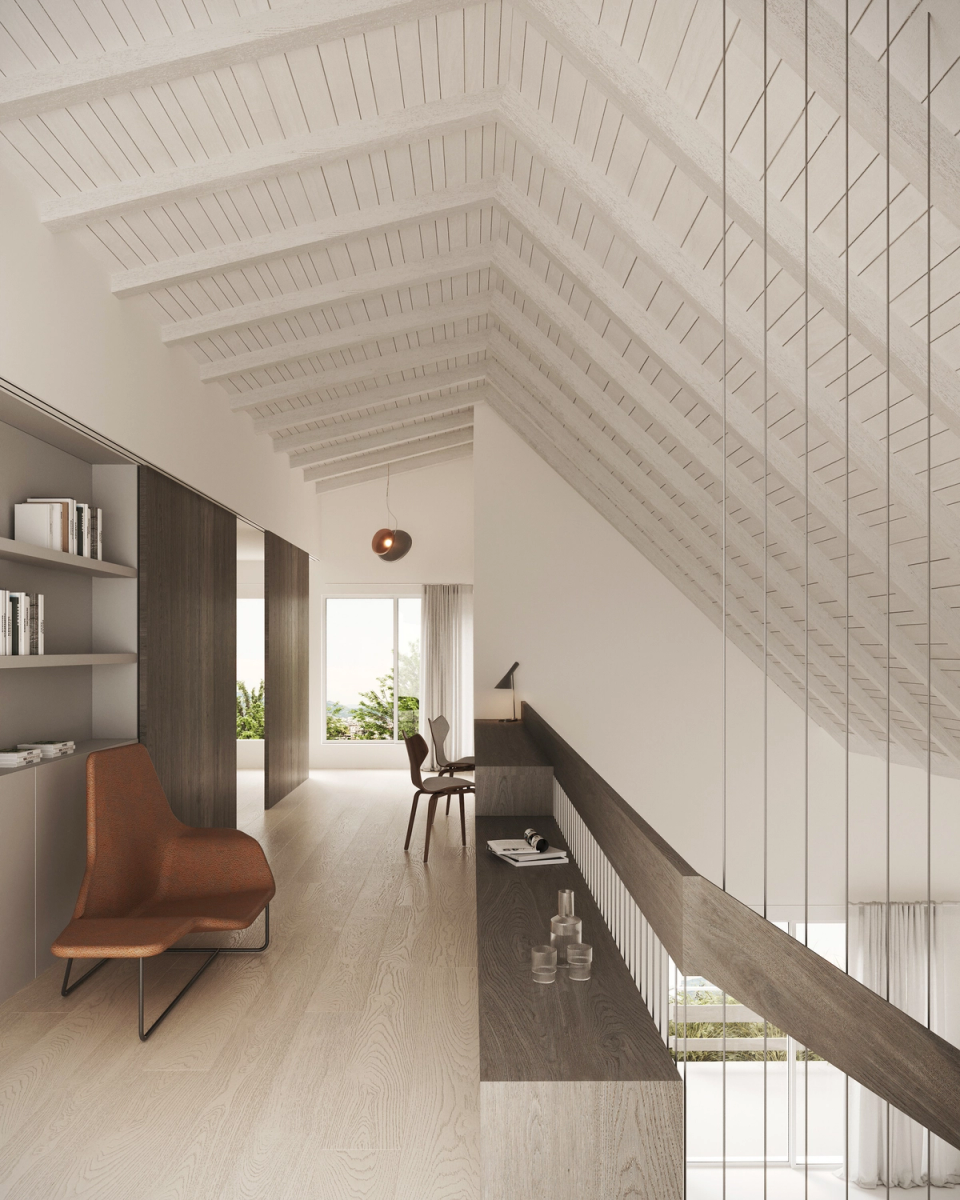 Interior renovation with an open mezzanine under the roof that takes advantage of the double height and natural light to create a calm and functional space. This interior renovation combines painted wooden ceilings, minimalist lines, and warm materials to generate a contemporary and welcoming atmosphere.