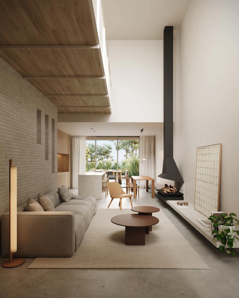 Houses in Bescanó with an open and bright living room connected to the dining area and outdoor spaces through large openings. These houses in Bescanó combine natural materials, wooden ceilings, and contemporary architecture designed to create warm and comfortable environments.