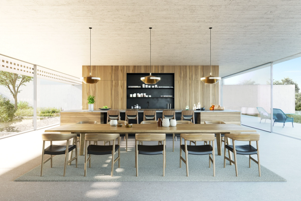 New construction house in Barcelona. Interior space with furniture of noble materials. The wood tones predominate and the space opens visually thanks to the large openings that communicates interior with exterior.