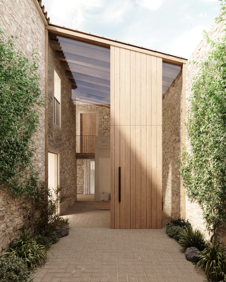 The rehabilitation and extension of this farmhouse incorporates new transitional spaces that connect traditional architecture with a contemporary perspective. The combination of existing stone, natural wood, and large openings enhances natural light and creates a warm and serene atmosphere, maintaining the original essence of the home while reinforcing the relationship with the outdoor spaces.