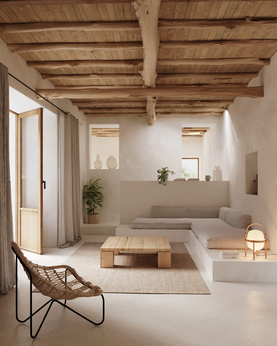 The renovation of this farmhouse in Ibiza creates warm and essential interiors where natural wood, mineral textures and light define the atmosphere of the space. Original beams and handcrafted materials reinforce the Mediterranean character of the architecture. The project embraces a serene and comfortable way of living connected to the essence of the island.