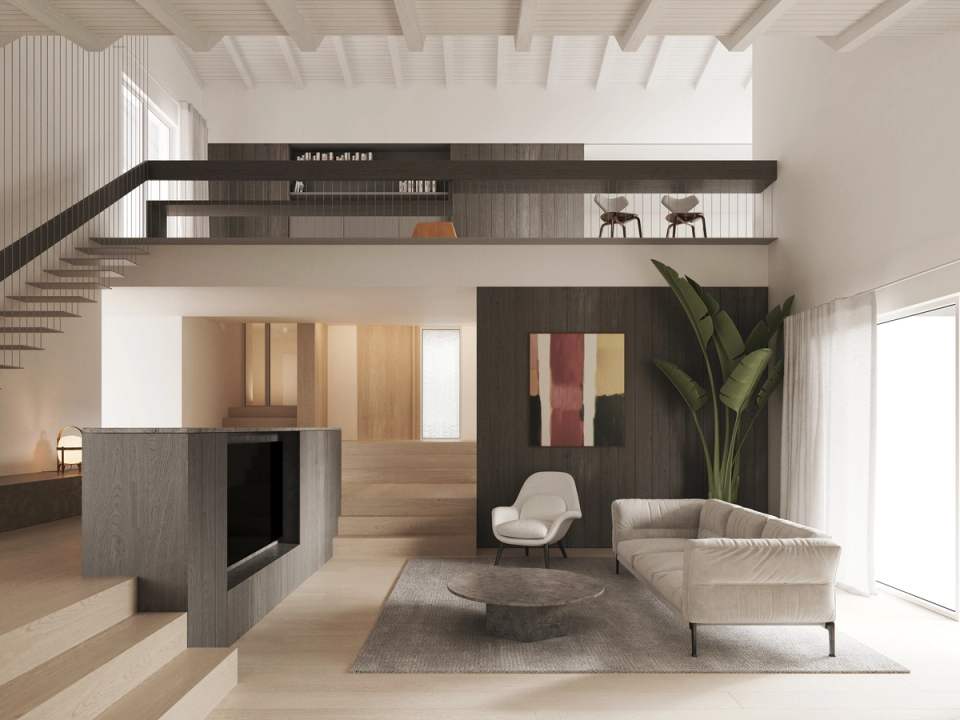 Interior renovation with a double-height space that connects the different areas of the house through an open and contemporary architecture. This interior renovation combines neutral materials, large windows, and elegant furniture to create a bright, sophisticated, and comfortable atmosphere.