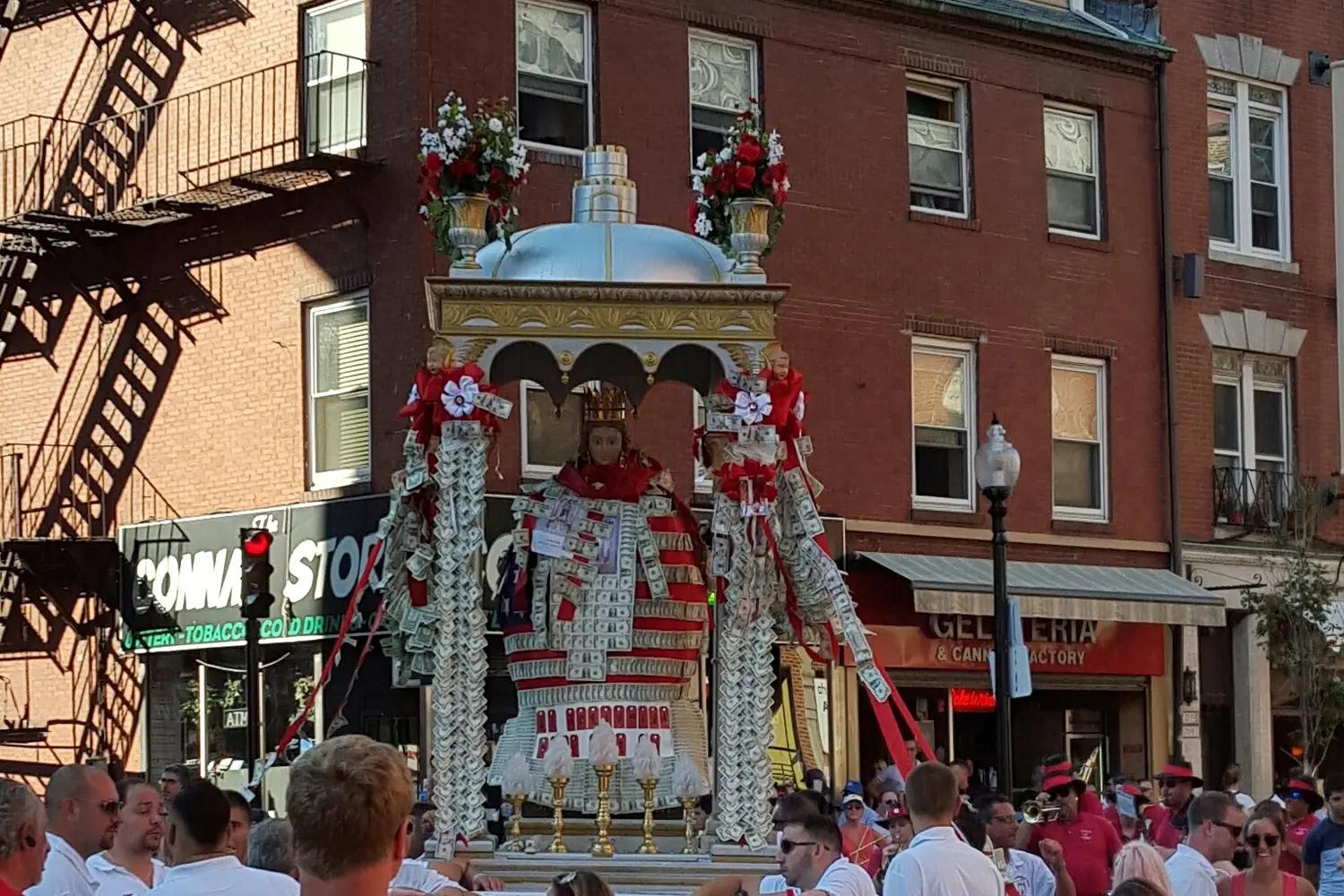 A St. Agrippina di Mineo procession moving through a crowded North End street in Boston