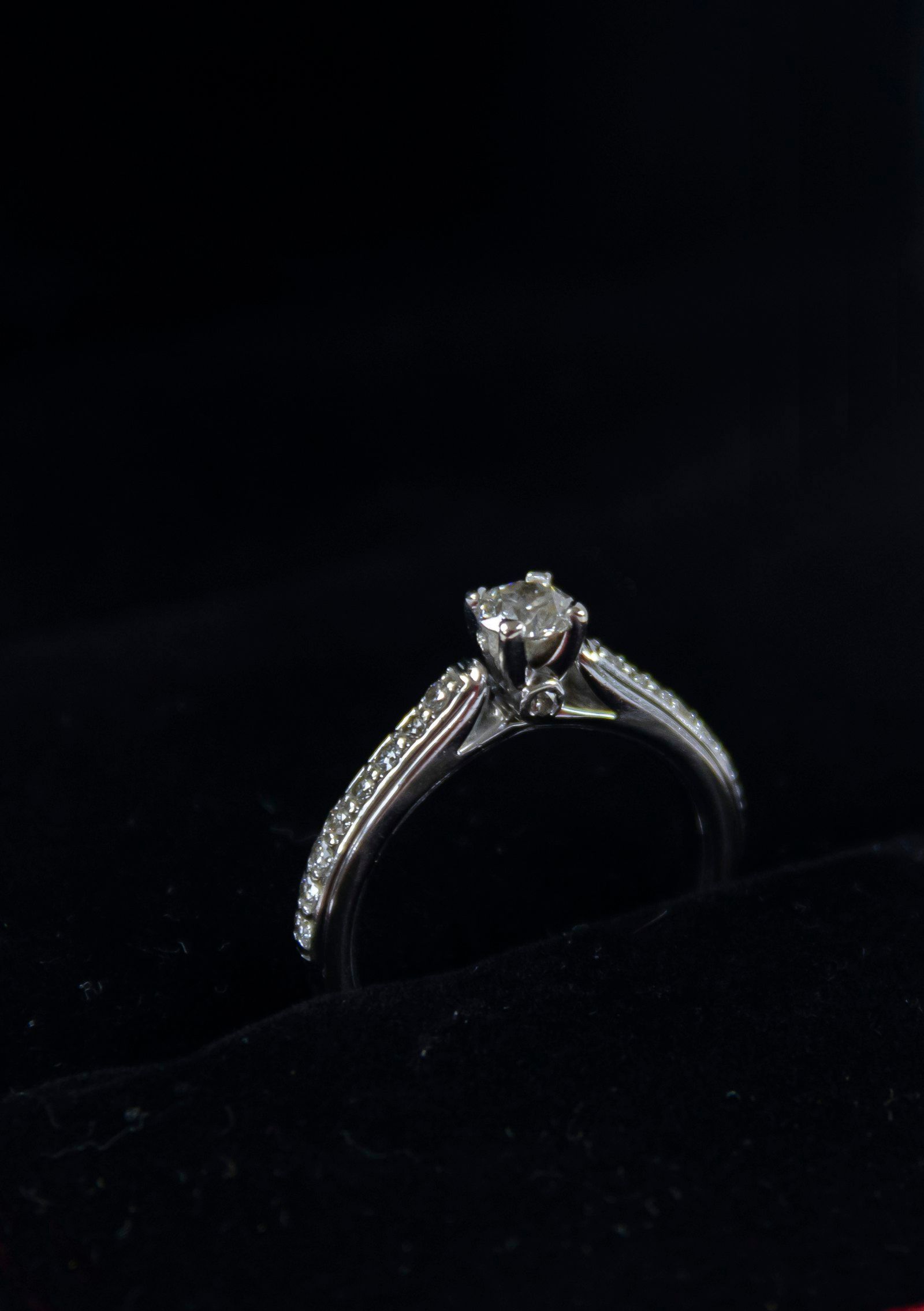A loose diamond held with tweezers