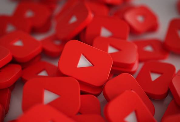 Red 3D play button icons stacked, representing video streaming and YouTube platform.