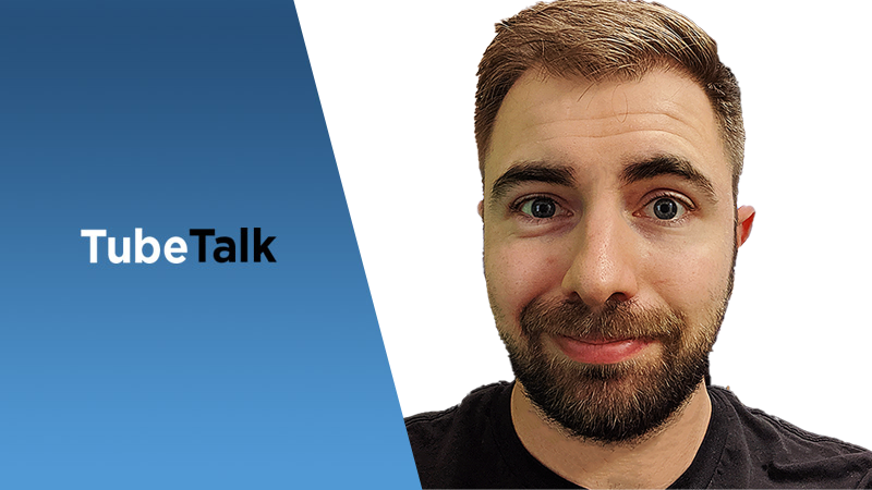 Smiling man with beard next to TubeTalk logo on blue and white background