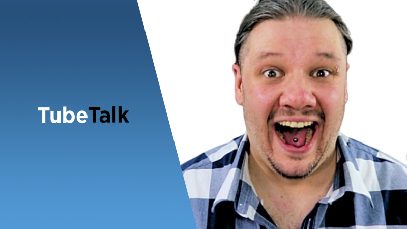 Man with tongue piercing smiling next to TubeTalk logo on blue and white background