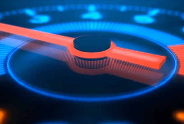 Close-up of a futuristic speedometer gauge with glowing blue and red indicators on black background