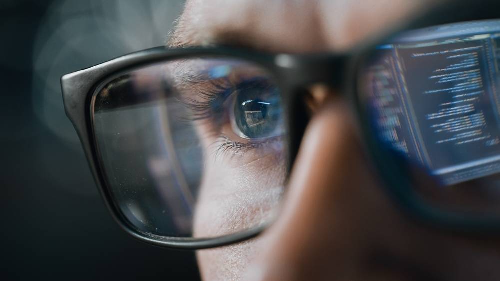 Close up of a man concentrating while analyzing data