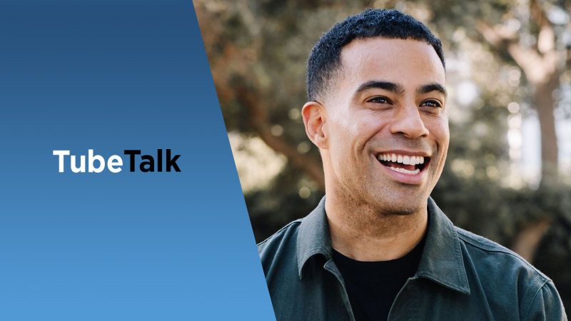 Smiling man with short hair beside blue background featuring TubeTalk logo and branding text