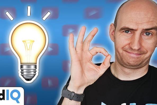 Man showing OK gesture next to glowing light bulb icon on blue background with vidIQ logo