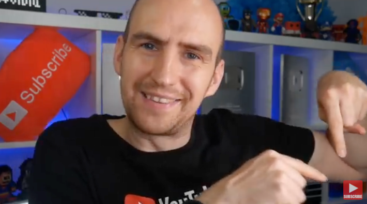 Rob Wilson pointing at the YouTube watermark in lower right hand corner