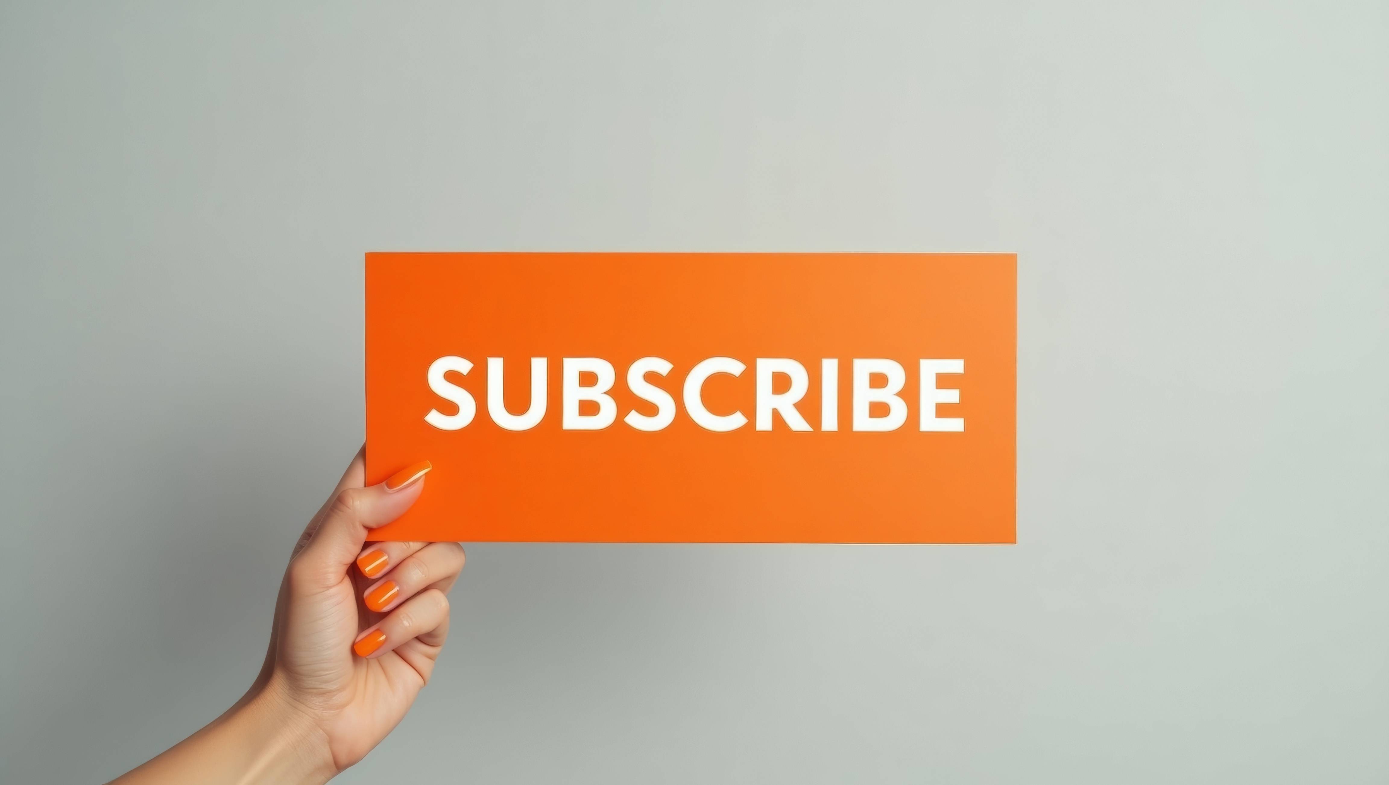 Creator holding a board that says "SUBSCRIBE"