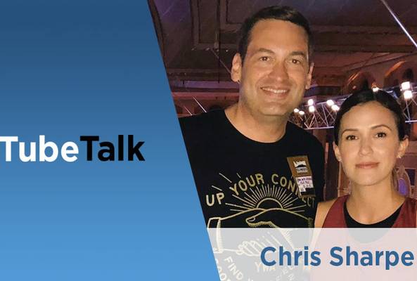 Chris Sharpe on TubeTalk podcast with a smiling male and female at an event venue