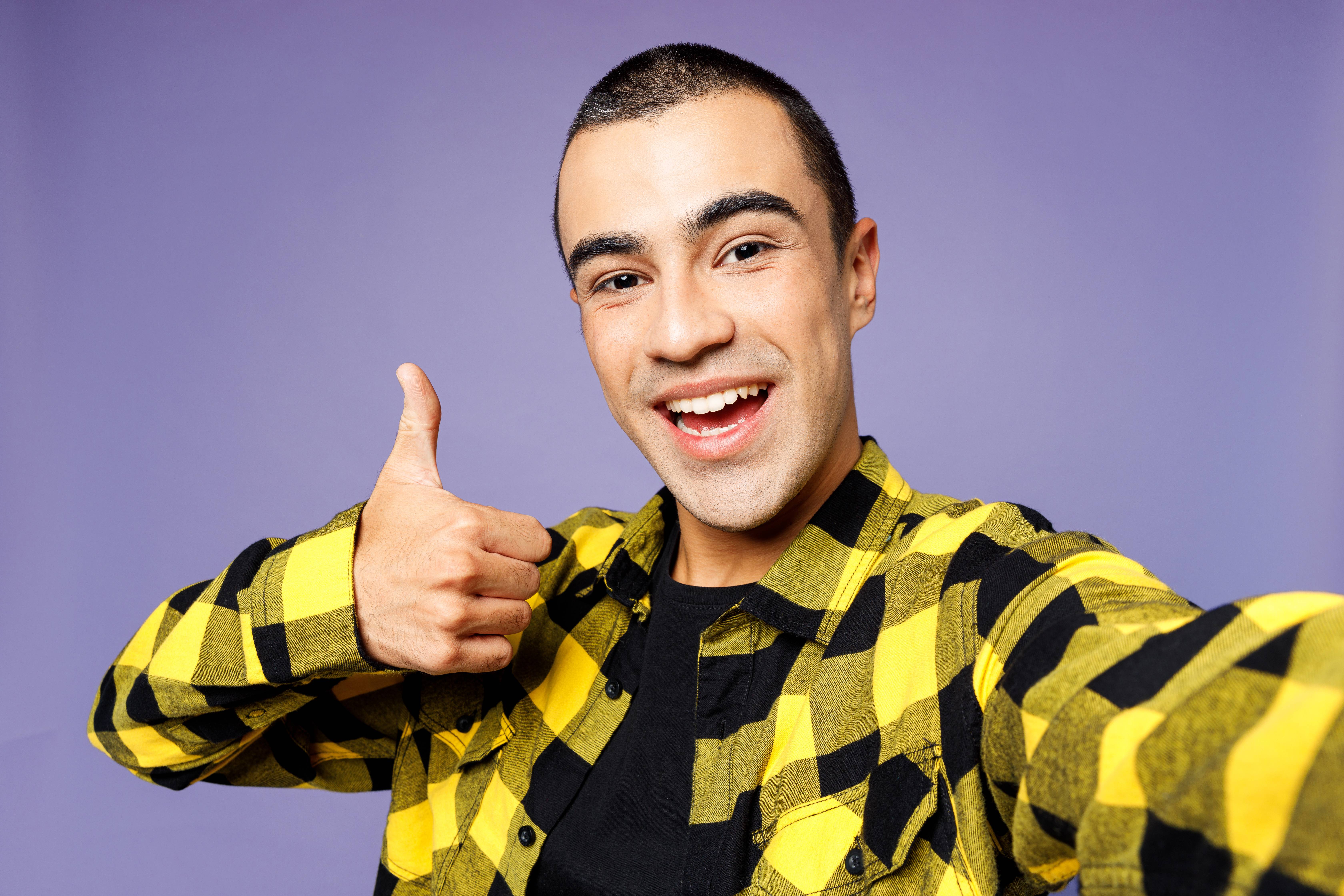 Man showing thumbs up to a camera