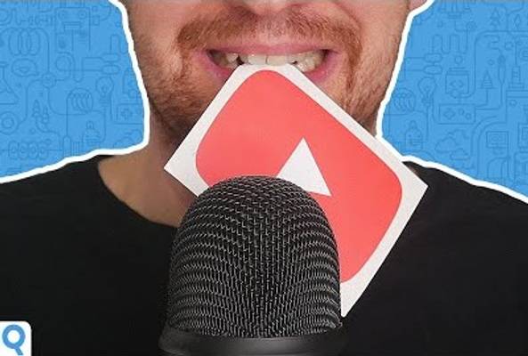 Person holding YouTube logo behind microphone against blue background with icons
