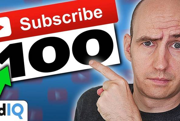 Man pointing at YouTube subscribe button with 100 subscribers and vidIQ logo background