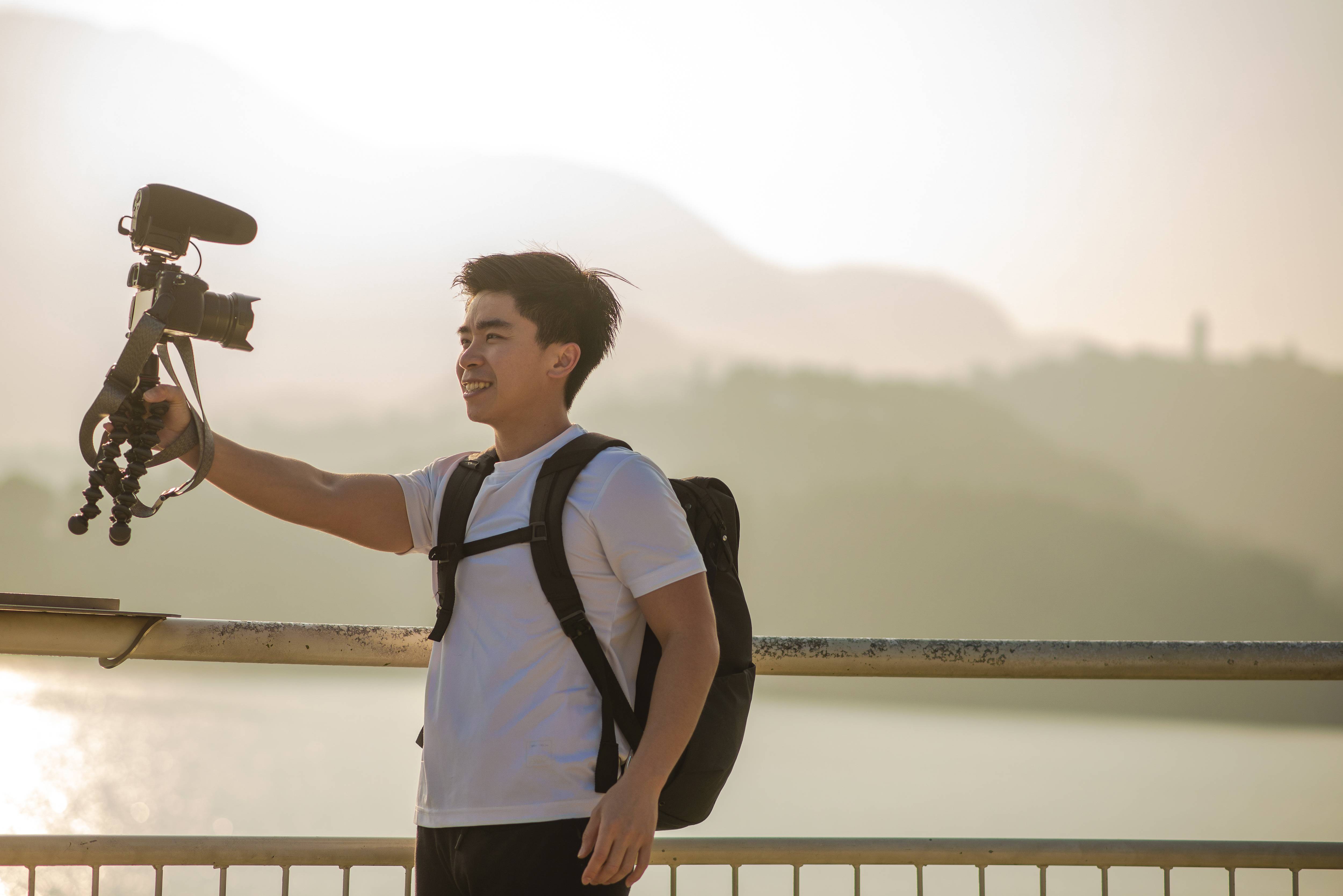 Man shooting a vlog with a dslr camera