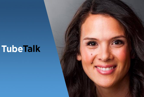 Smiling woman with dark hair next to TubeTalk logo on blue and gray background