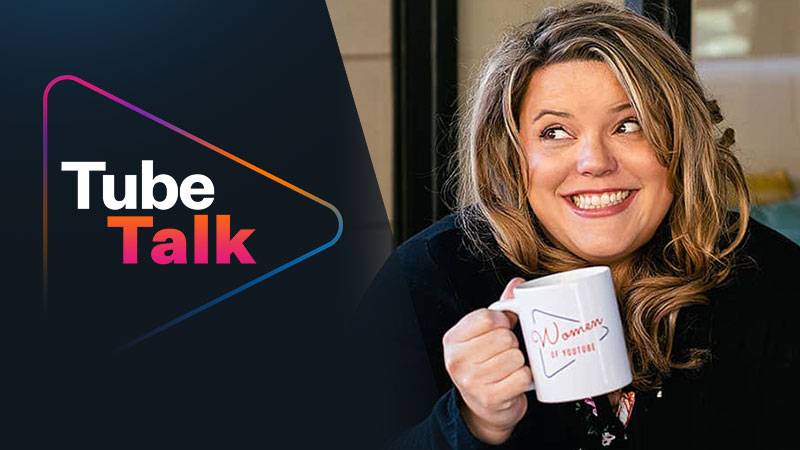 Woman smiling and holding a "Women of YouTube" mug with Tube Talk logo beside her
