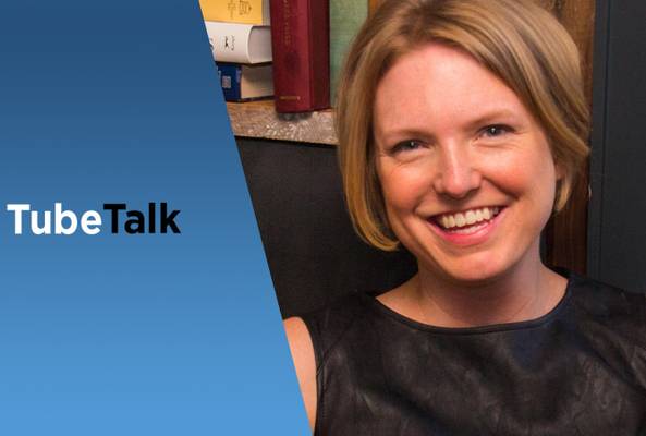 Smiling woman beside TubeTalk logo on blue background, representing video podcast discussion.