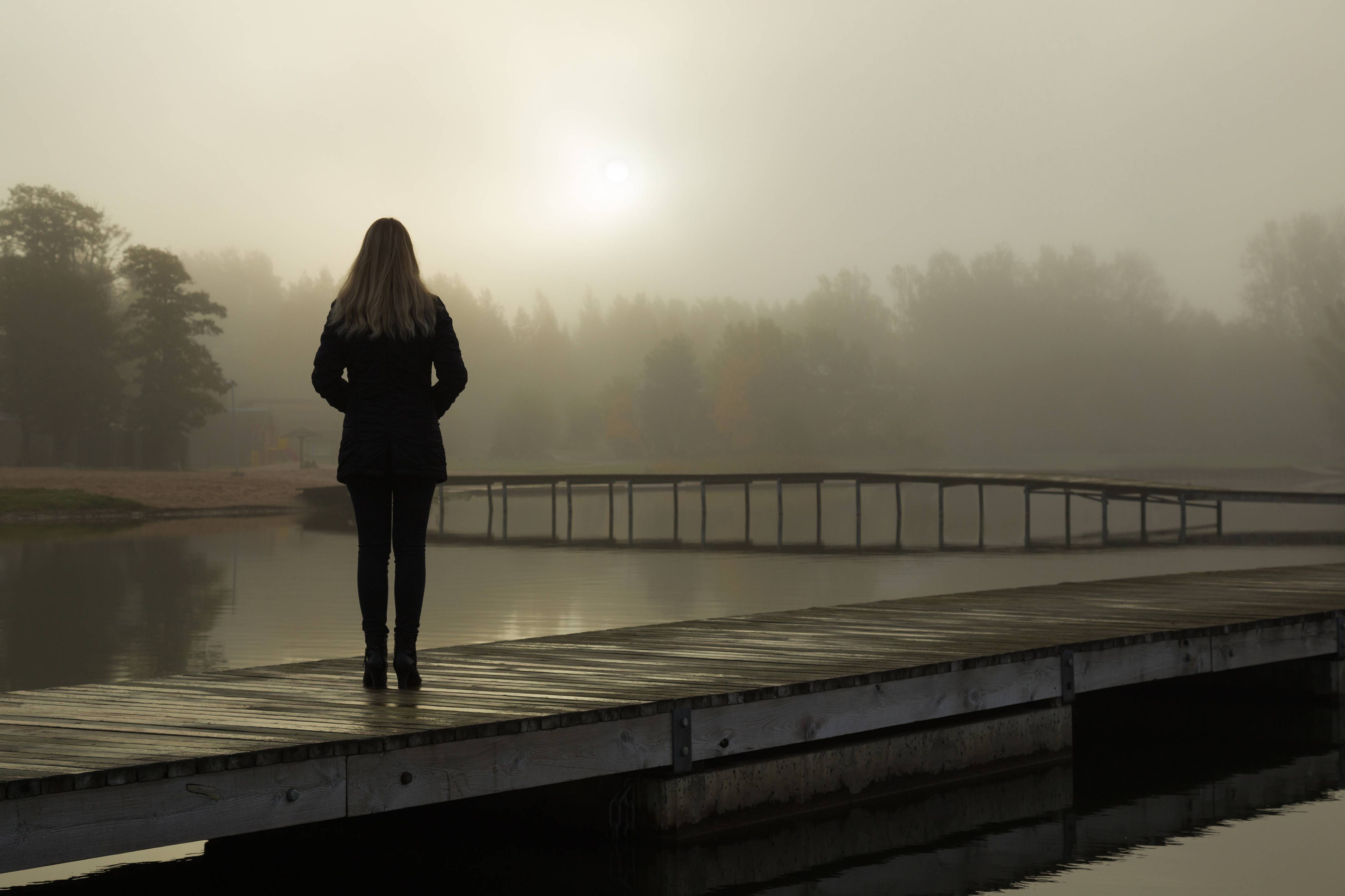 lonely woman on a bridge