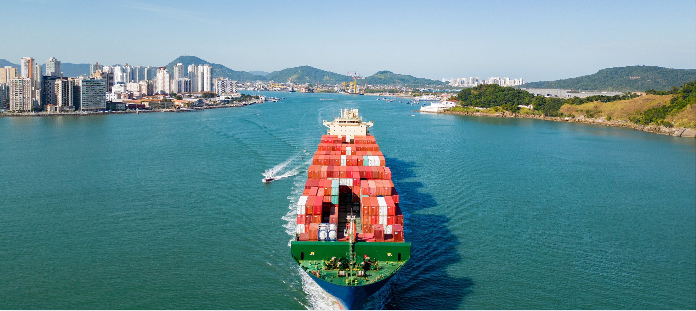 A PICTURE OF A GIANT SHIP COMING INTO A SOUTH AMERICAN PORT FOR DELIVERY