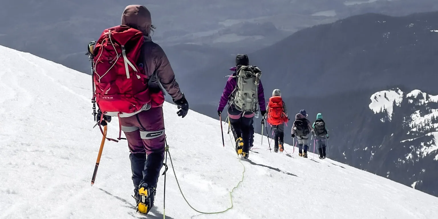 people walking on mountain connected to each other