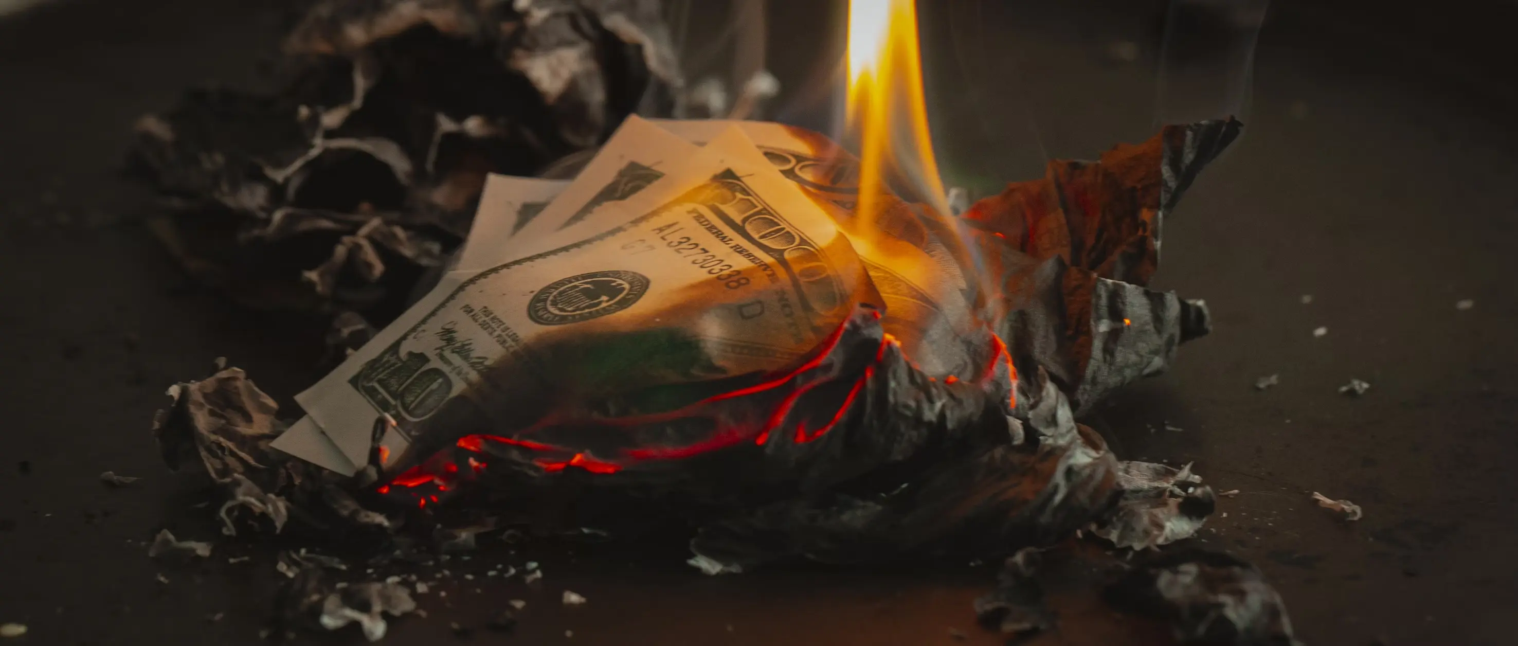 Paper bills on fire
