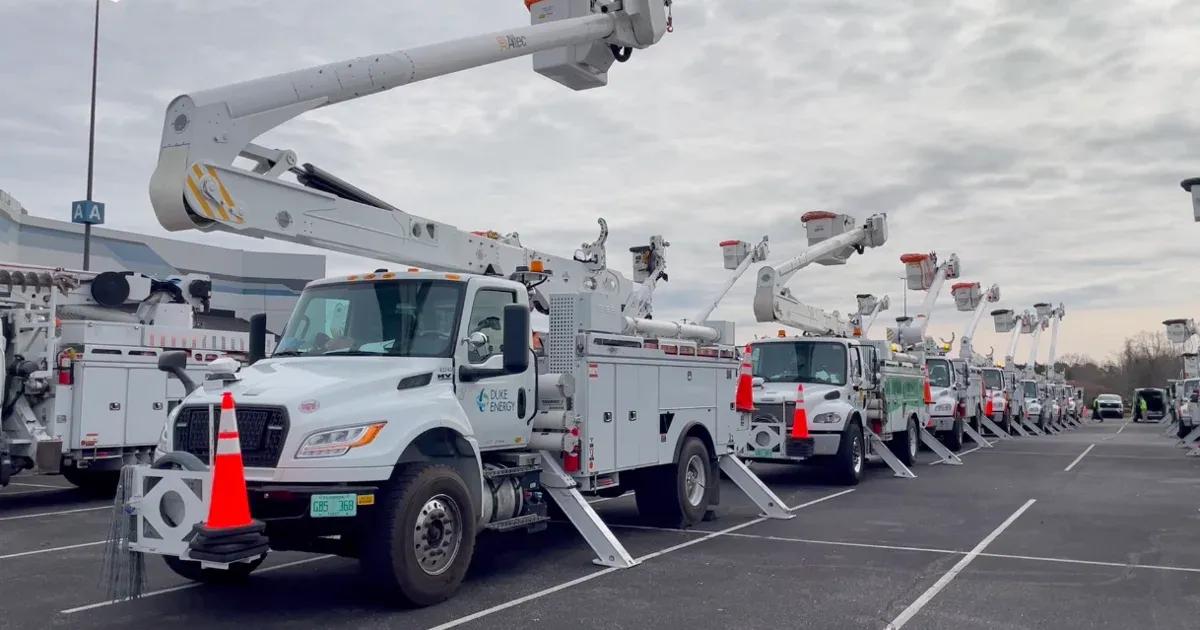 picture of cherry picker trucks lined up for services