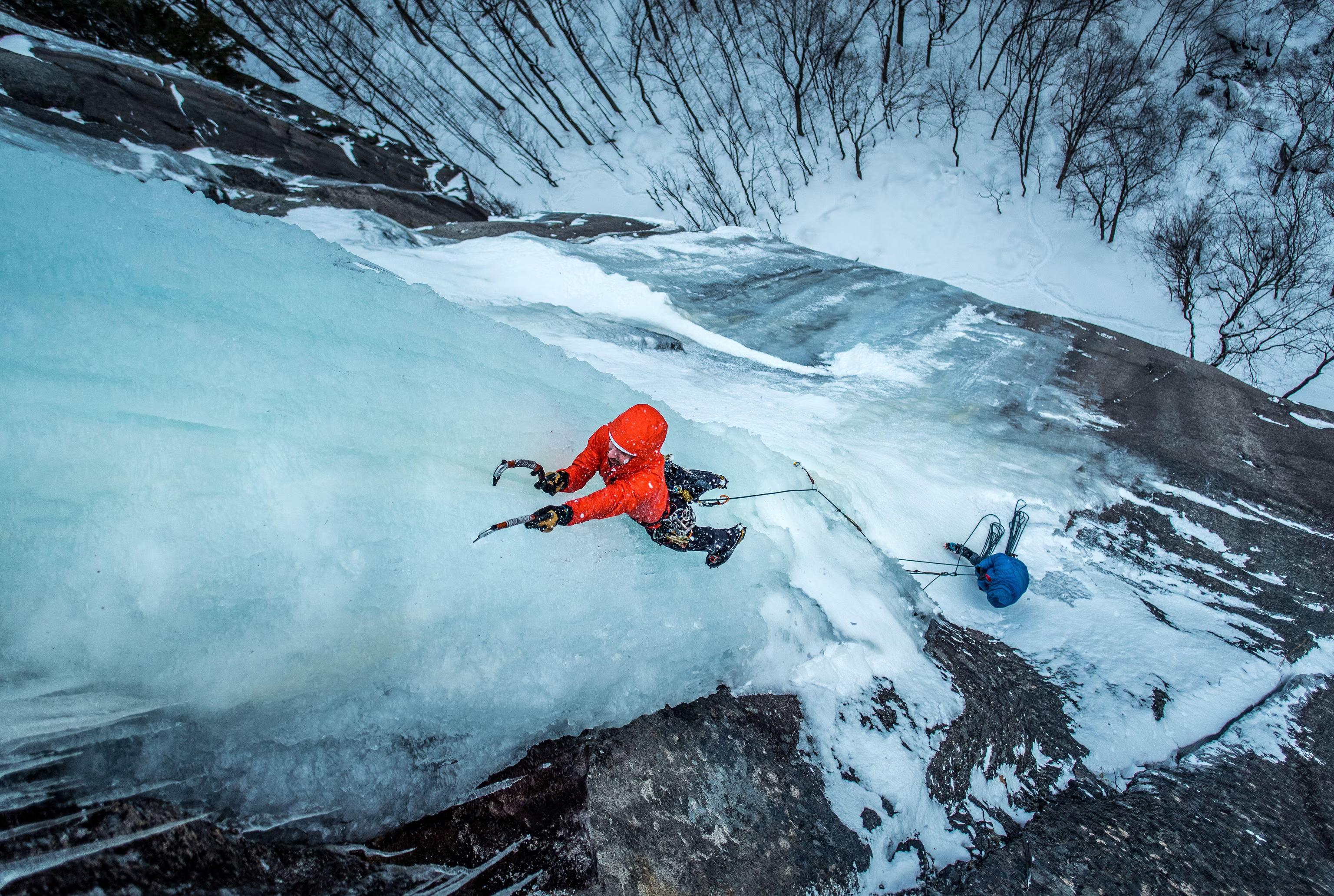Colorado Mountain School student climbing up a big piece of ice