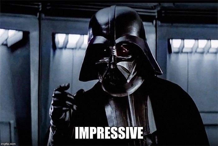 Darth Vader in black armor with text reading "IMPRESSIVE" below him in a spaceship corridor.
