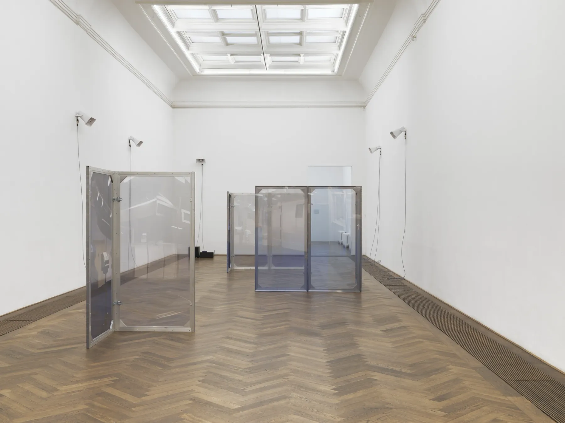 Dorota Gawęda and Eglė Kulbokaitė, Enclosure (upiór) I-VIII, 2024. Aluminium, wood, digital print on chiffon. 200 x 100 x 3.5 cm each (variable dimensions of installation).