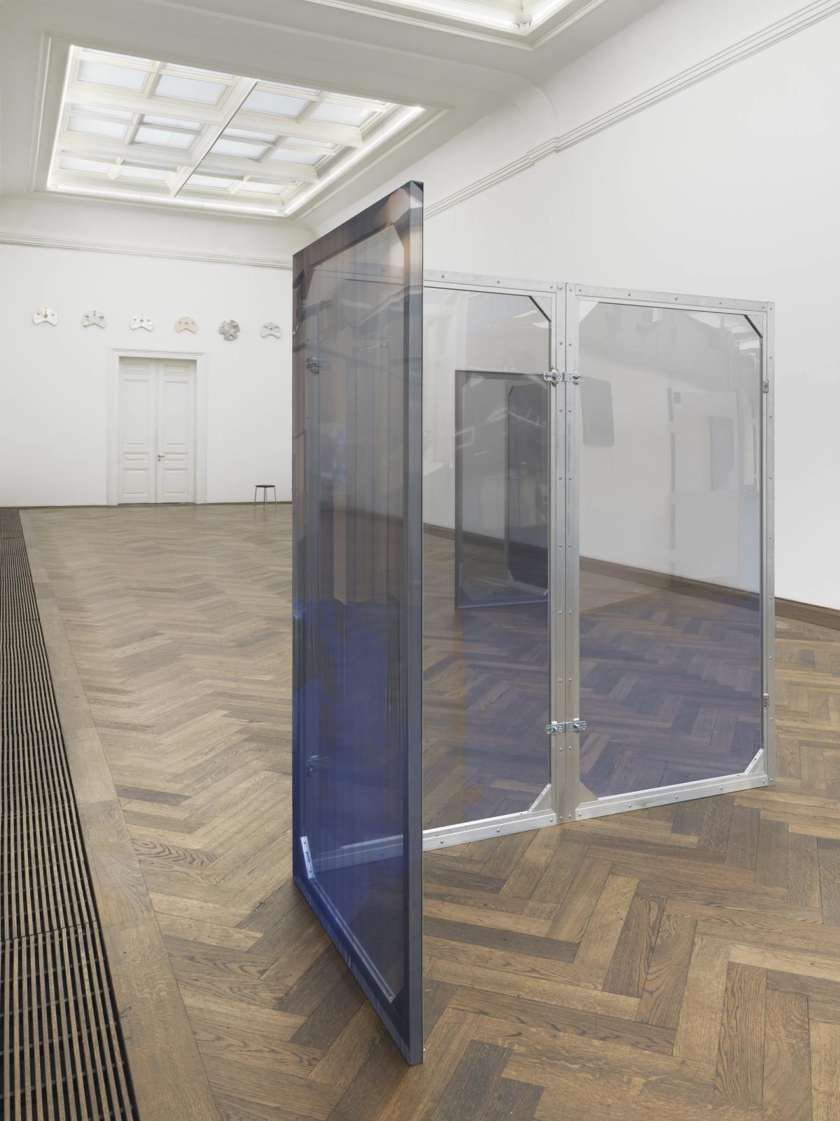Dorota Gawęda and Eglė Kulbokaitė, Enclosure (upiór) I-VIII, 2024. Aluminium, wood, digital print on chiffon. 200 x 100 x 3.5 cm each (variable dimensions of installation).