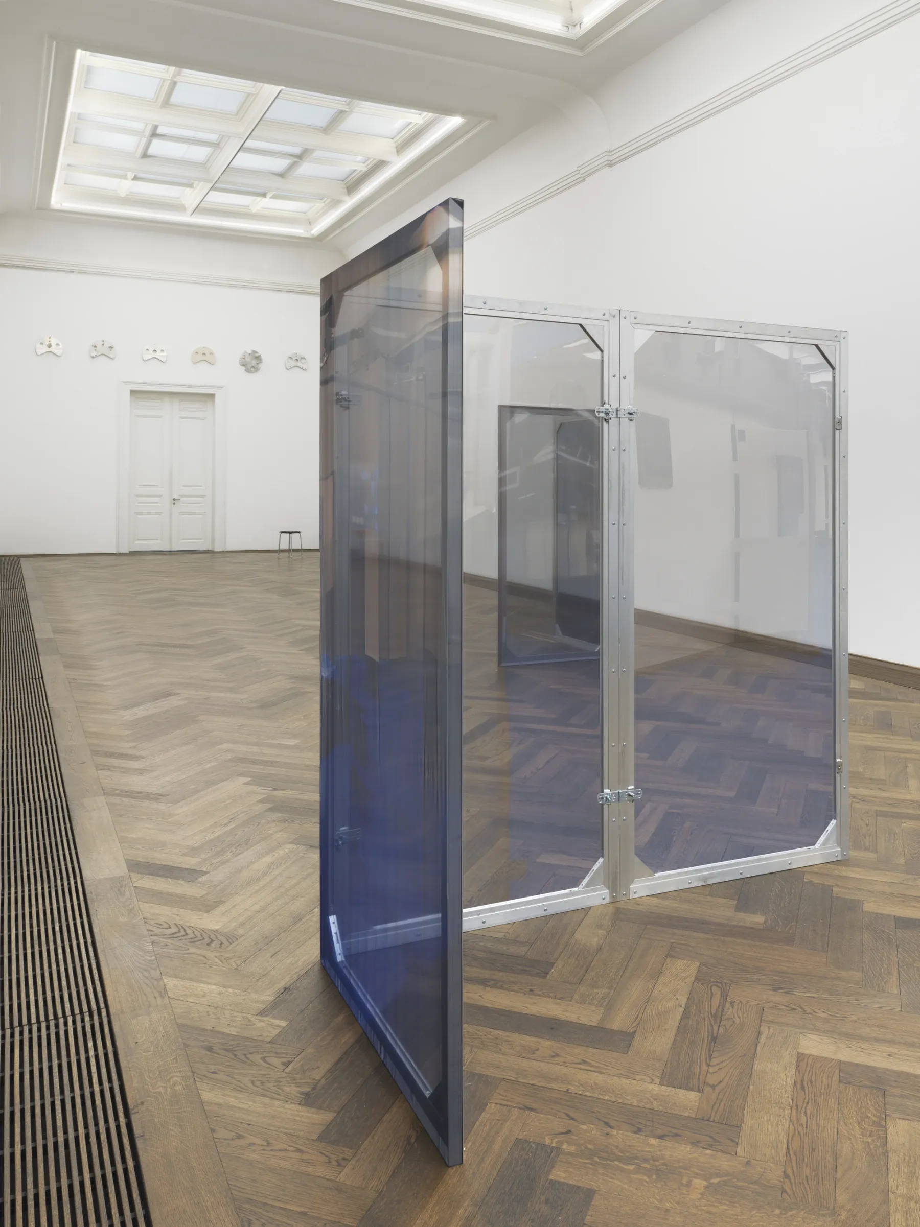 Dorota Gawęda and Eglė Kulbokaitė, Enclosure (upiór) I-VIII, 2024. Aluminium, wood, digital print on chiffon. 200 x 100 x 3.5 cm each (variable dimensions of installation).