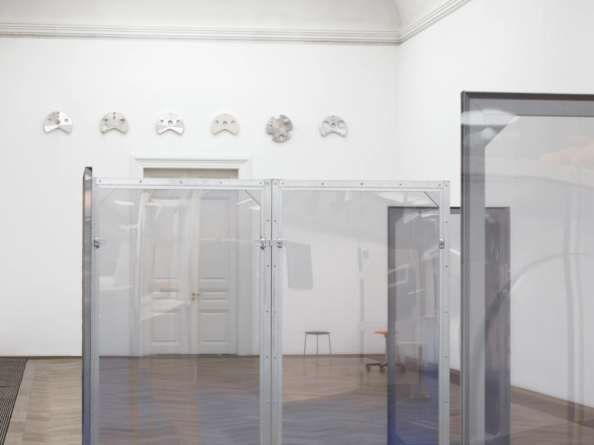 Dorota Gawęda and Eglė Kulbokaitė, Enclosure (upiór) I-VIII, 2024. Aluminium, wood, digital print on chiffon. 200 x 100 x 3.5 cm each (variable dimensions of installation).
