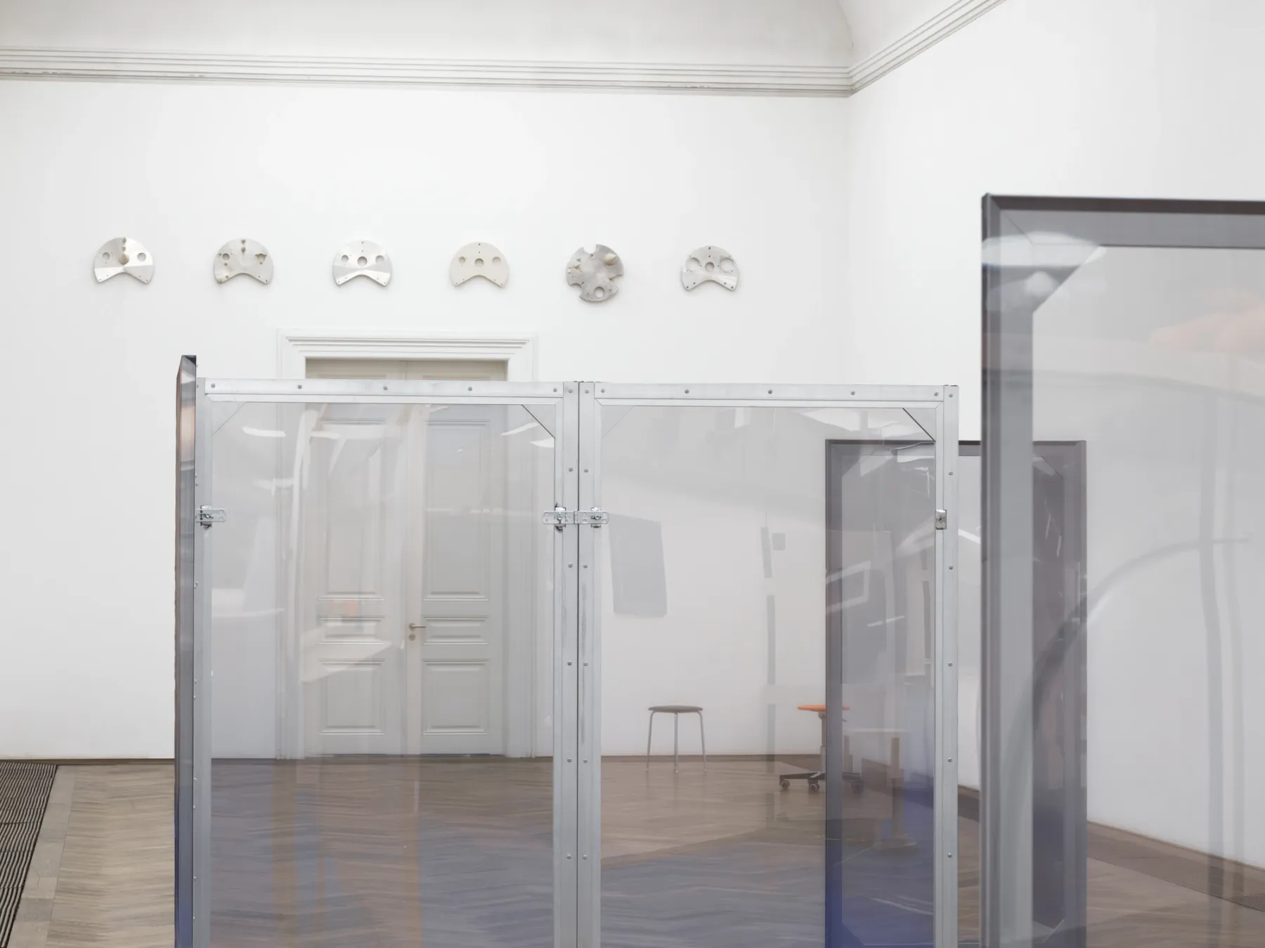 Dorota Gawęda and Eglė Kulbokaitė, Enclosure (upiór) I-VIII, 2024. Aluminium, wood, digital print on chiffon. 200 x 100 x 3.5 cm each (variable dimensions of installation).