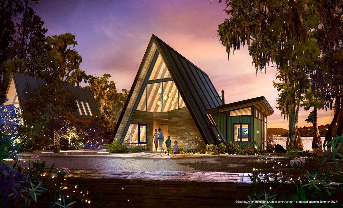 The image depicts a modern, A-frame style lodge situated near a lakeshore, illuminated by a sunset. A family of three, including an adult and two children, is seen approaching the lodge, which features large windows and a combination of wood and metal materials.