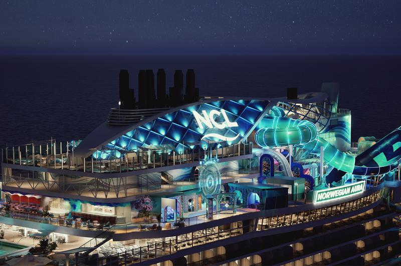 The image showcases the Norwegian Cruise Line ship, Norwegian Prima, illuminated at night. The ship features vibrant LED lights, including a large water slide and various entertainment areas on the upper deck.