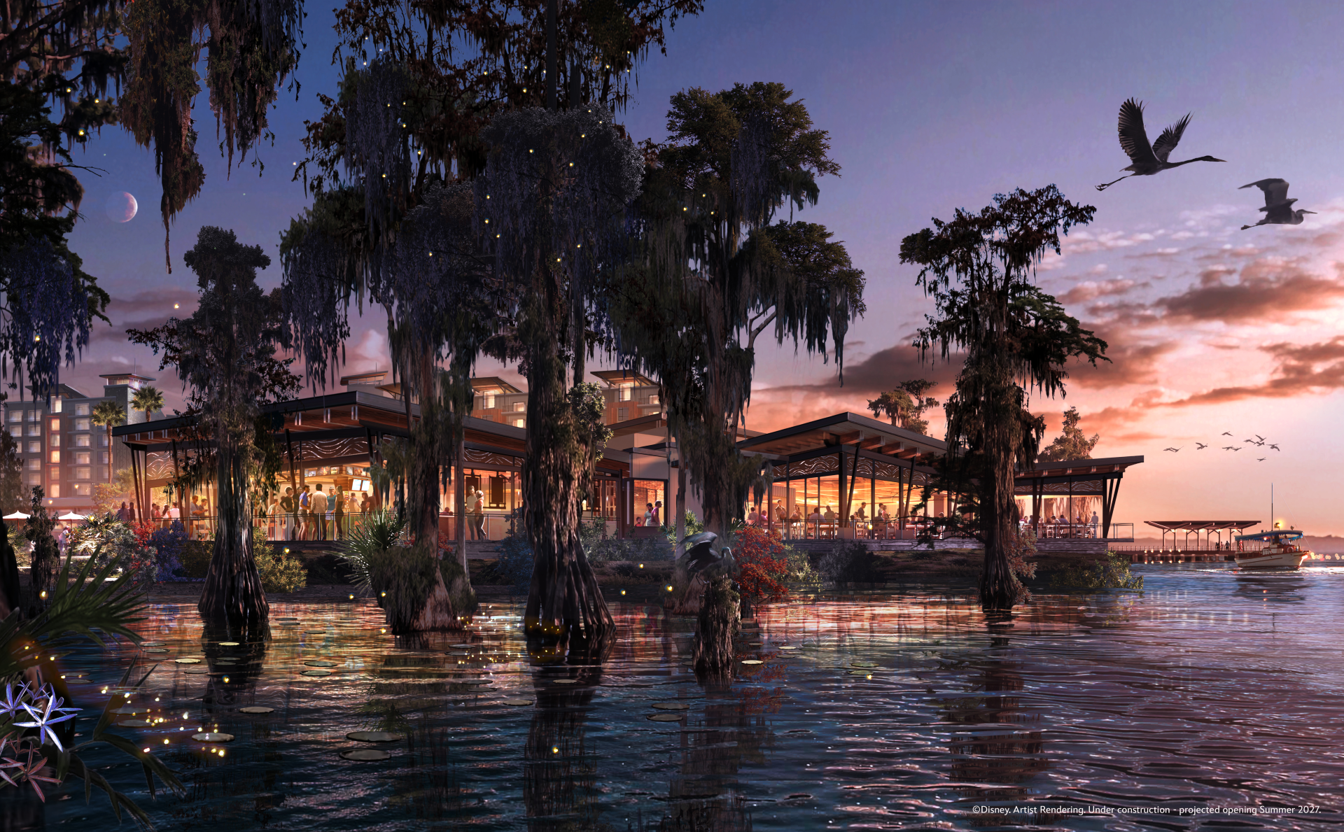 A picturesque waterfront scene featuring a modern building surrounded by cypress trees and water. The setting is during sunset, creating a vibrant atmosphere with reflections on the water's surface.