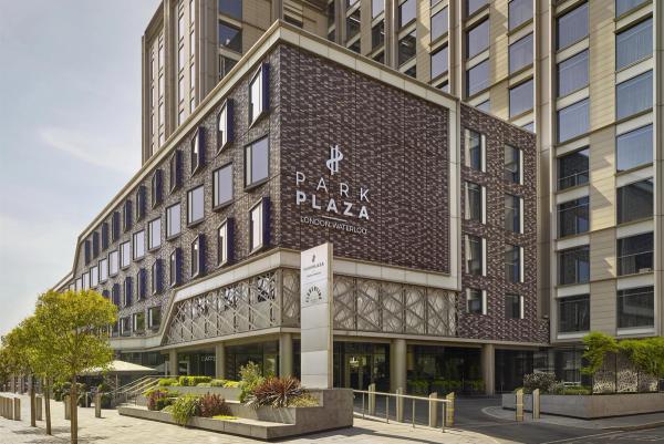 The image shows the exterior of the Park Plaza London Westminter hotel. The modern architecture is highlighted by a prominent entrance and detailed facade.
