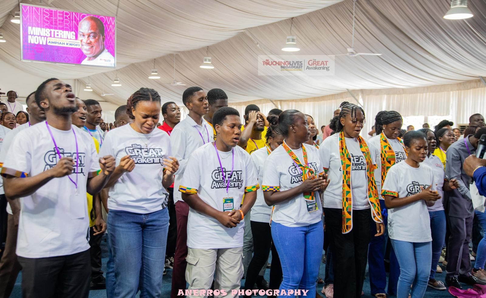 Worshippers with hands lifted at The Great Awakening