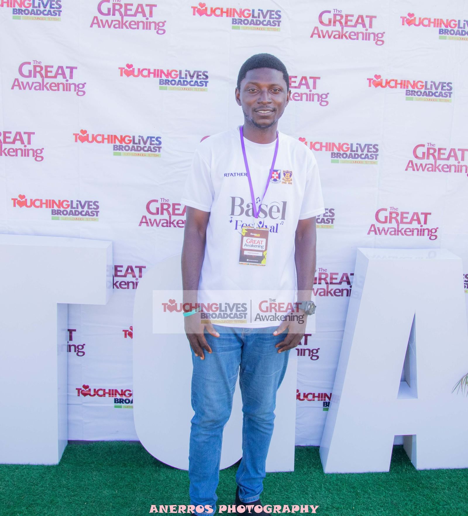 An attendee at the Touching Lives photo wall