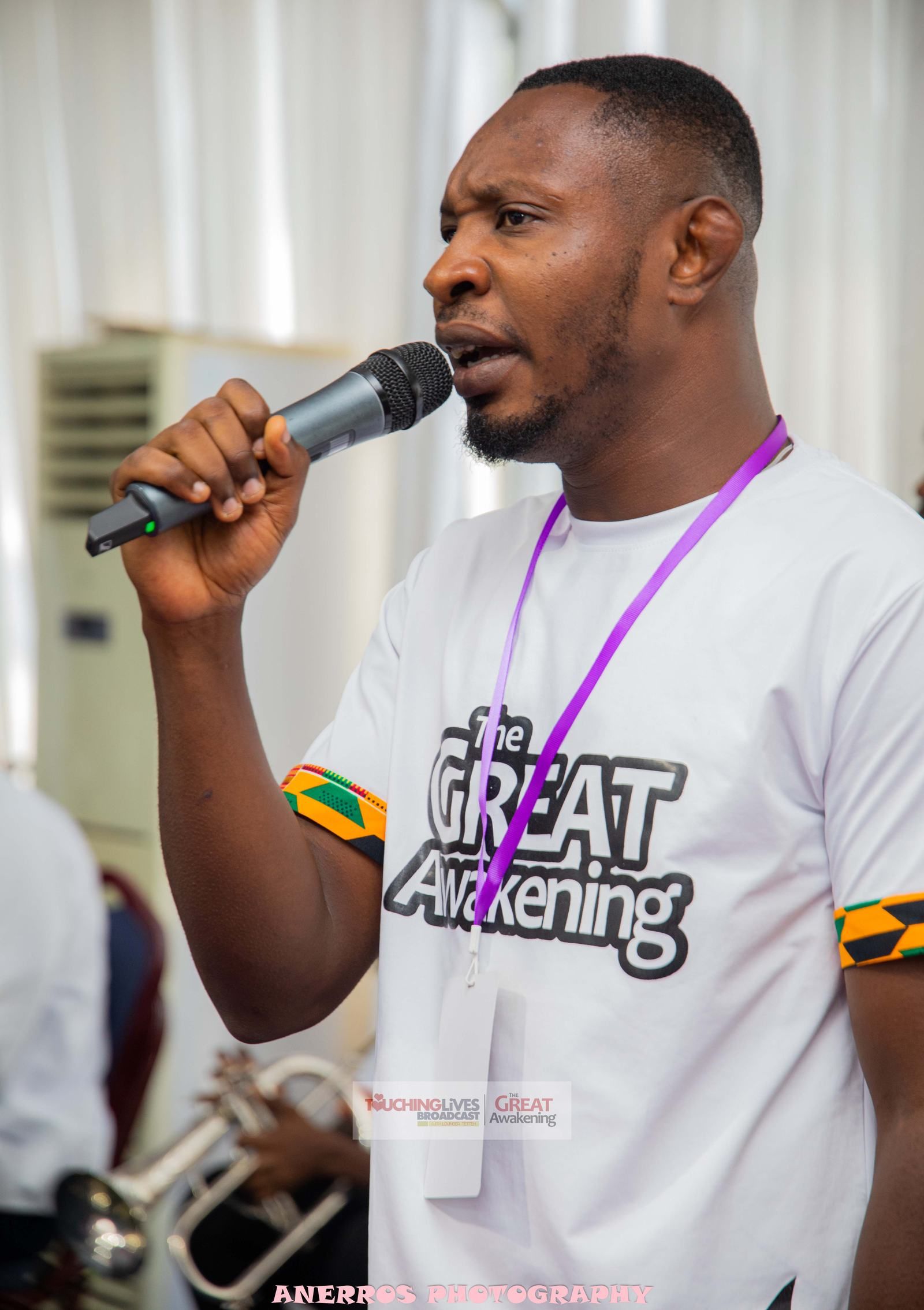 A praise leader ministering with the microphone