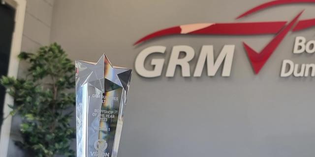 Vizion award trophy with GRM logo in the background