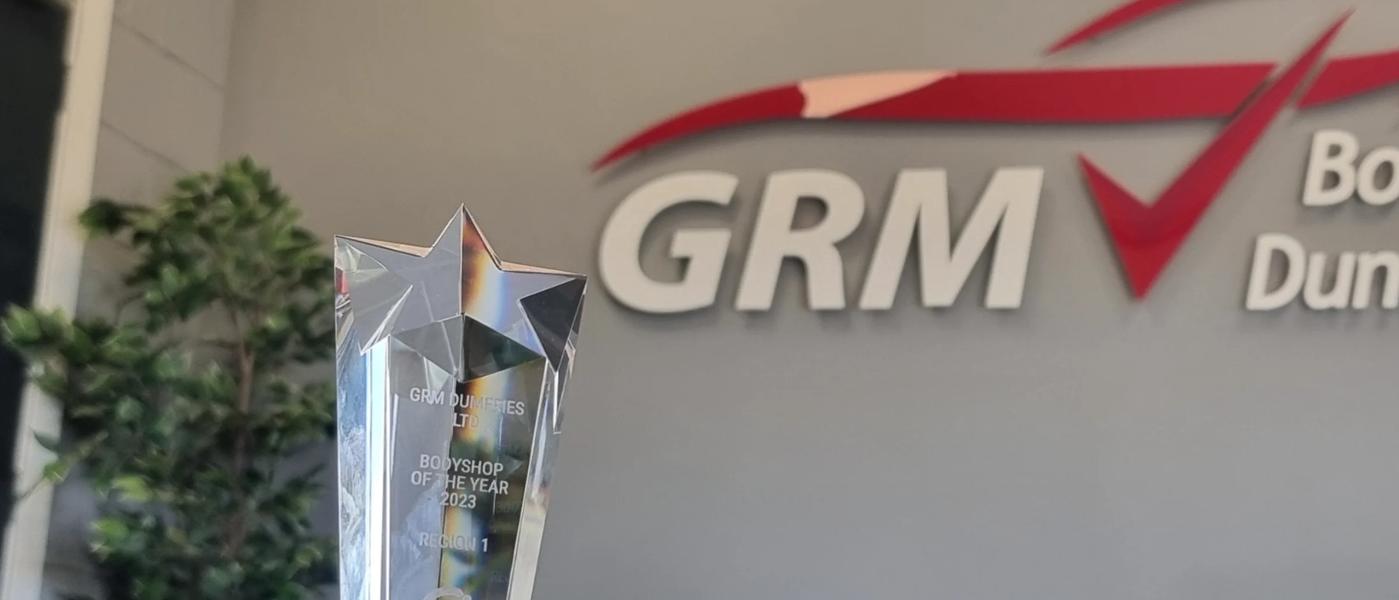 Vizion award trophy with GRM logo in the background