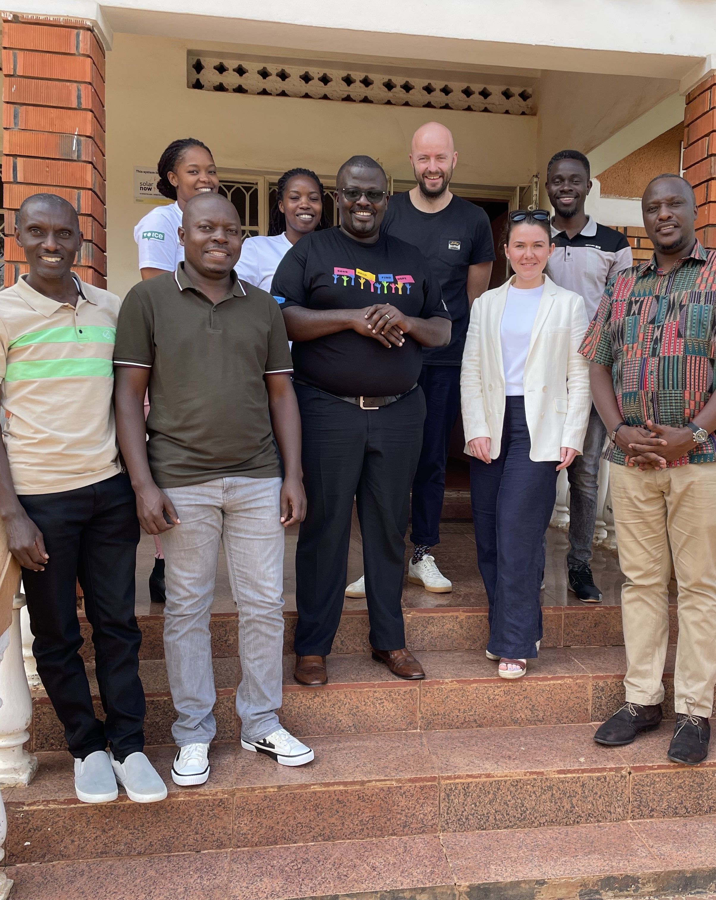 Two of our employees on a project visit to Uganda