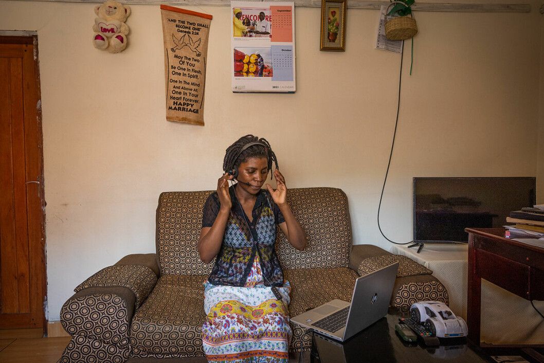 A counsellor taking a call for the free helpline in Uganda