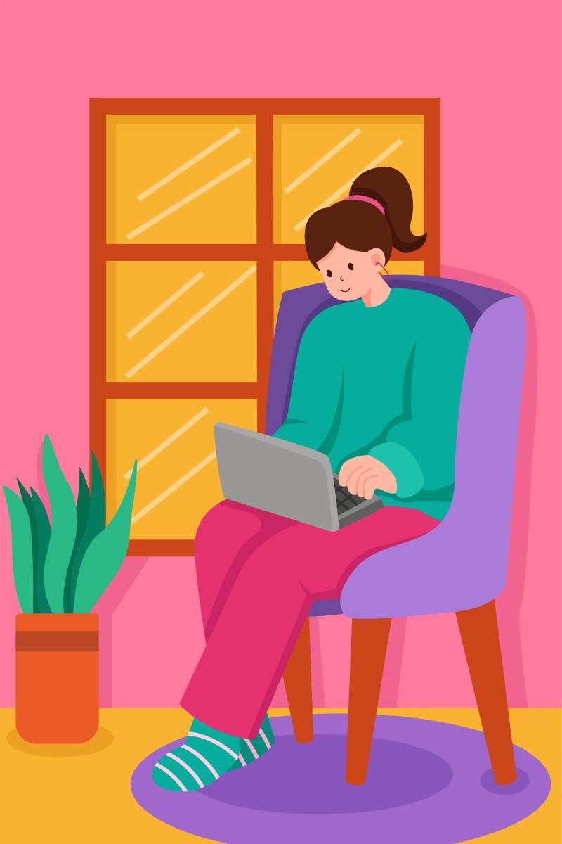 Person sitter i stol og jobber på laptop ved vindu.